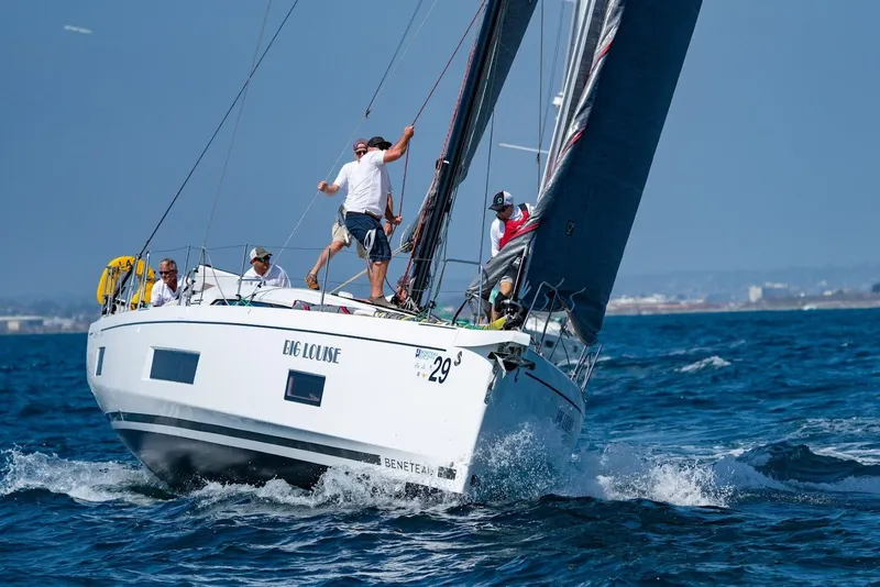 Slide: The Image of 2022 Beneteau Oceanis 46.1 sailing on open water with crew onboard. - 6