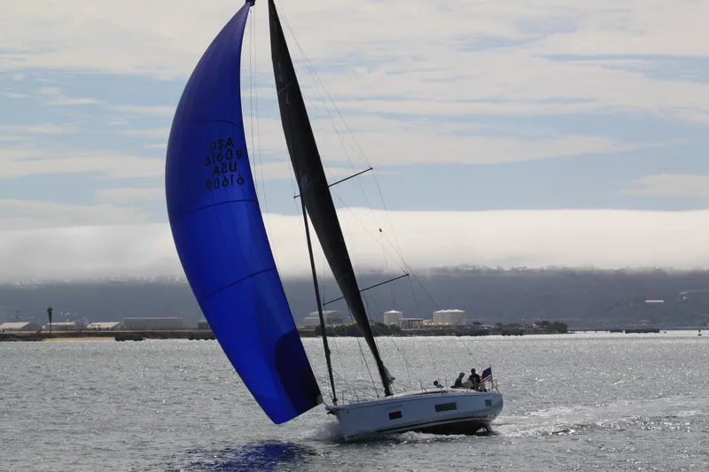 Slide: The Image of 2022 Beneteau Oceanis 46.1 sailing with blue spinnaker on open water. - 7