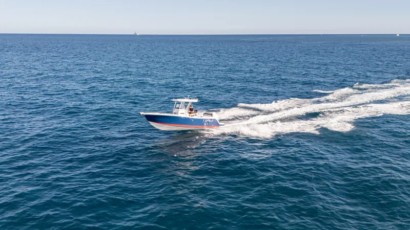 Slide: The Image of 2025 SeaWell 240CC boat cruising on open ocean waters. - 14