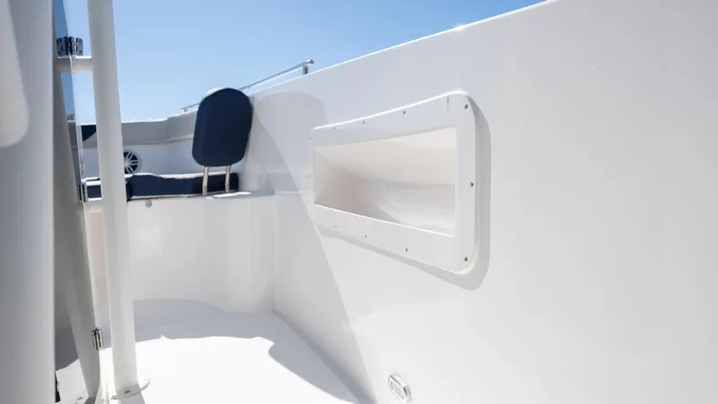 Slide: The Image of 2025 SeaWell 240CC boat interior with sleek white design and seating. - 22