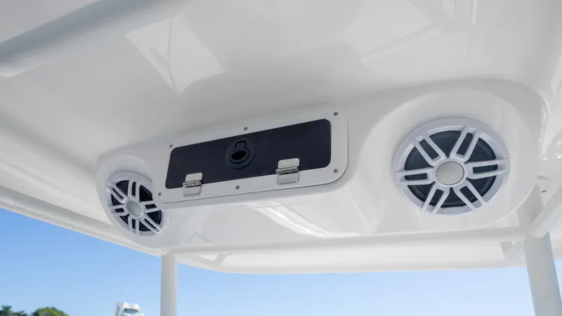 Slide: The Image of 2025 SeaWell 240CC boat speakers and storage compartment on white ceiling. - 24