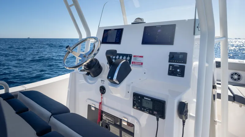Slide: The Image of 2025 SeaWell 240CC boat dashboard with ocean view, featuring modern controls and navigation systems. - 26