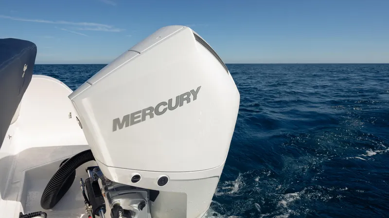 Slide: The Image of Outboard motor on SeaWell 240CC boat, 2025 model, cruising on open ocean. - 30
