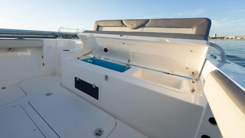 Slide: The Image of 2025 SeaWell 240CC boat interior with open storage compartment, showcasing sleek design and functionality. - 34