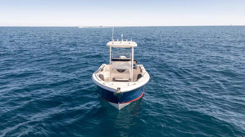 Slide: The Image of 2025 SeaWell 240CC boat on open ocean, clear sky, calm waters. - 4