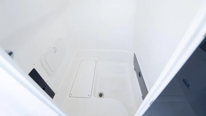 Slide: The Image of Interior view of 2025 SeaWell 240CC boat compartment, featuring a clean, white design. - 40