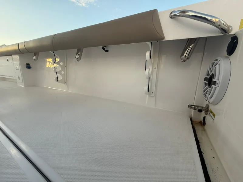 Slide: The Image of 2023 Everglades 273 Center Console boat interior with speaker and rod holders. - 11