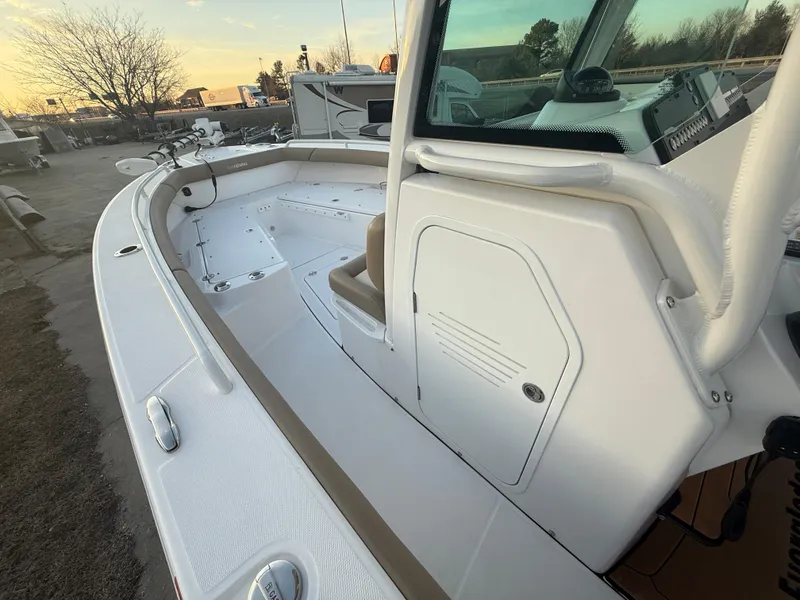 Slide: The Image of 2023 Everglades 273 Center Console boat, showcasing spacious deck and modern design. - 18
