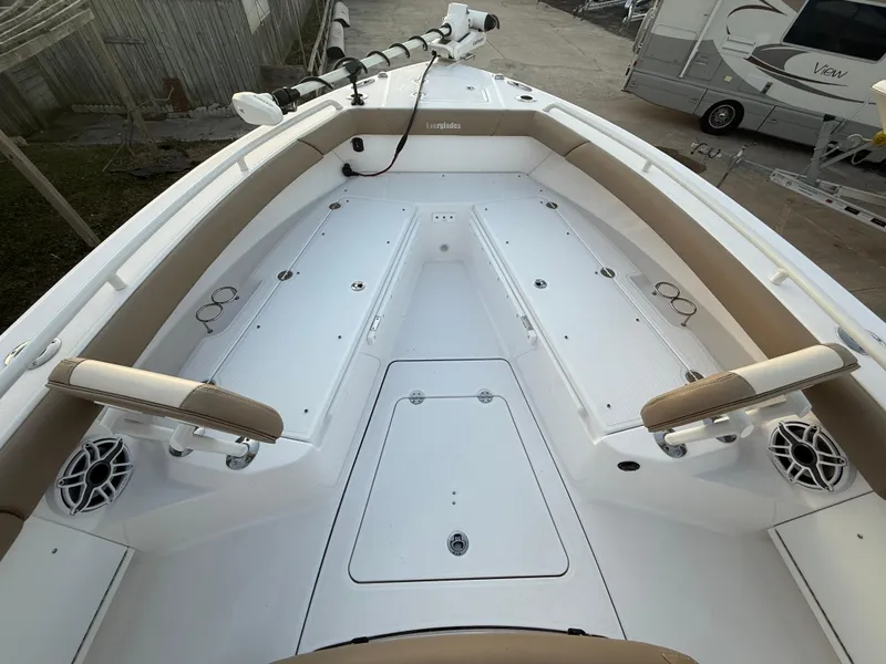 Slide: The Image of 2023 Everglades 273 Center Console boat interior with seating and storage compartments. - 22