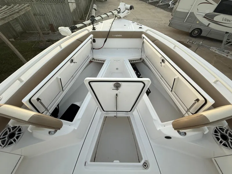 Slide: The Image of 2023 Everglades 273 Center Console boat interior with open storage compartments. - 23