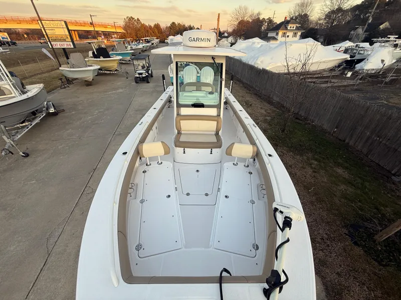 Slide: The Image of 2023 Everglades 273 Center Console boat with Garmin equipment, docked outdoors. - 26