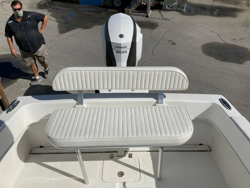 Slide: The Image of 2021 Dusky 252 T boat with white seating and Yamaha 300 engine. - 29