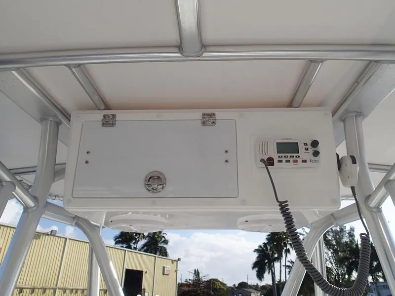 Slide: The Image of 2021 Dusky 252 T boat console with radio and storage compartment. - 32