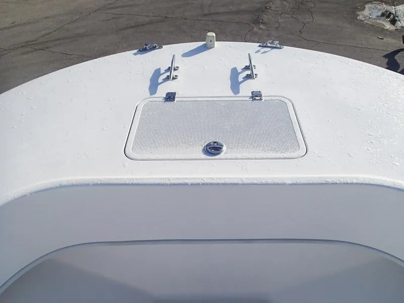Slide: The Image of Bow of 2021 Dusky 252 T boat with hatch and cleats. - 36