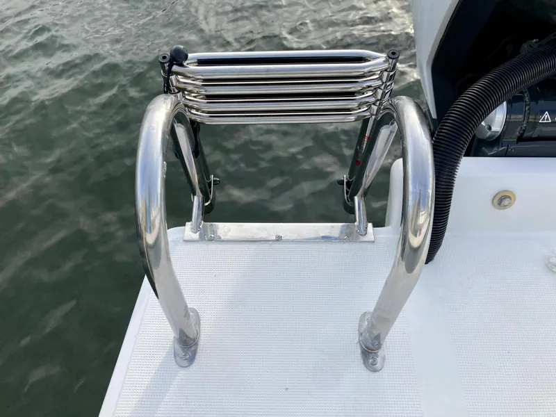 Slide: The Image of Stainless steel boat ladder on Dusky 252 T, 2021 model, over water. - 38