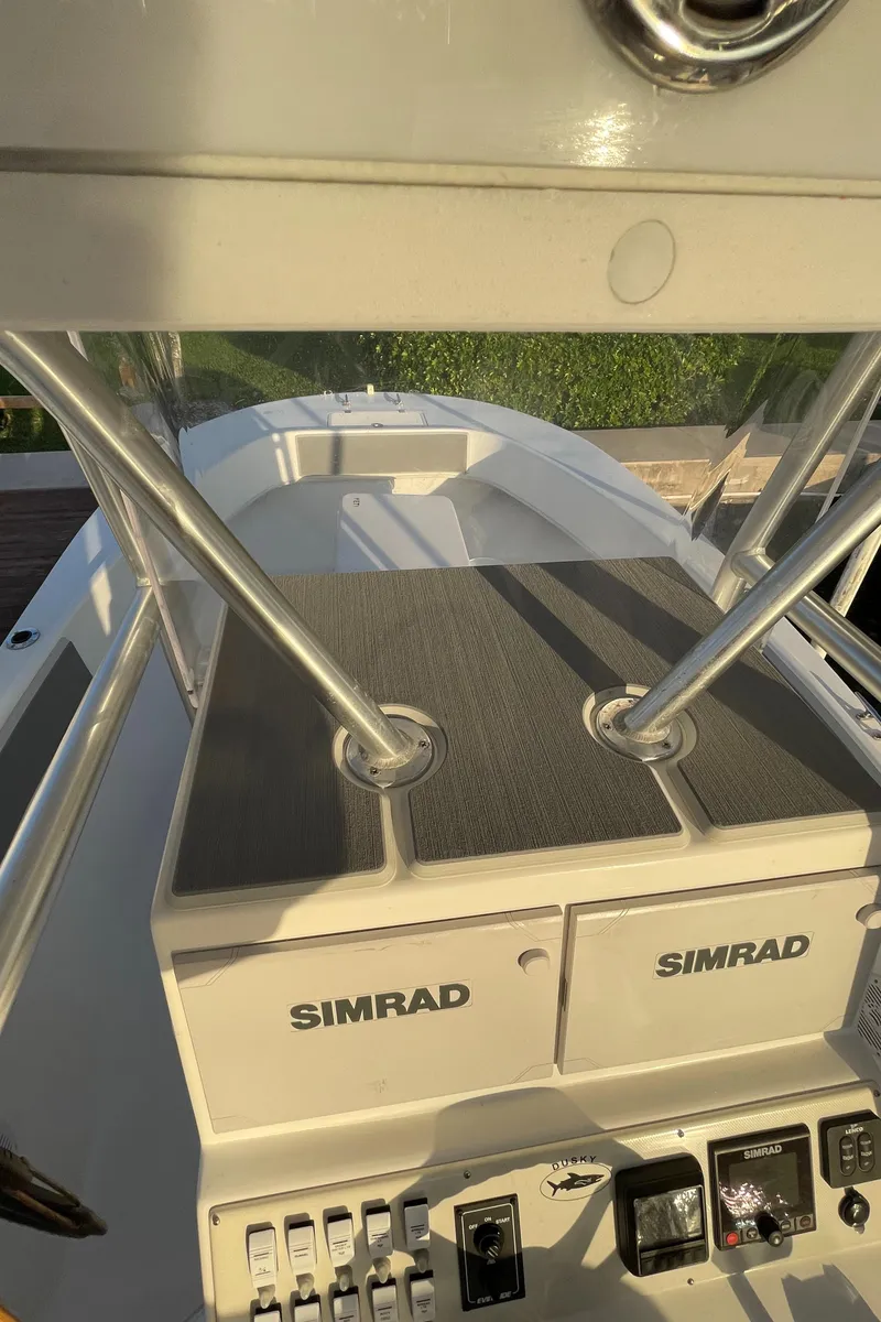 Slide: The Image of Dusky 252 T boat dashboard with Simrad electronics, 2021 model. - 41