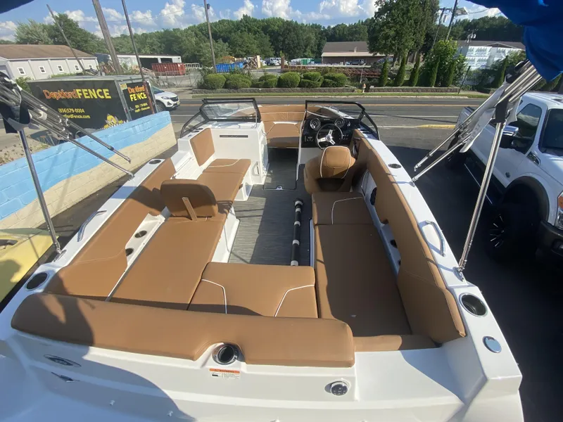 Slide: The Image of 2023 Glastron GTD 220 boat with spacious seating and modern design. - 7