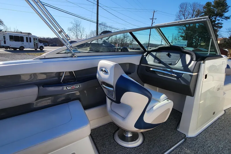 Slide: The Image of 2015 Chaparral 226 SSi boat interior with modern seating and dashboard. - 10