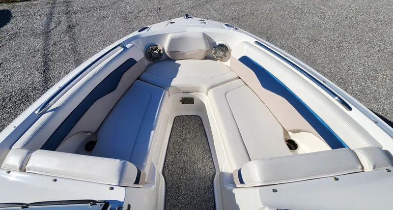 Slide: The Image of 2015 Chaparral 226 SSi boat interior with white and blue seating. - 11