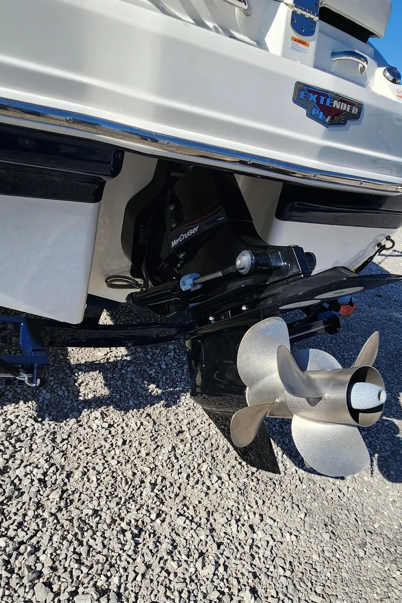 Slide: The Image of 2015 Chaparral 226 SSi boat stern with propeller on gravel surface. - 14