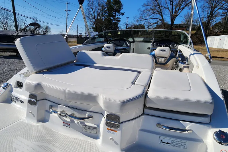 Slide: The Image of 2015 Chaparral 226 SSi boat interior with white seating and dashboard. - 16