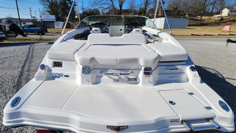 Slide: The Image of 2015 Chaparral 226 SSi boat, rear view, showcasing spacious deck and seating area. - 5