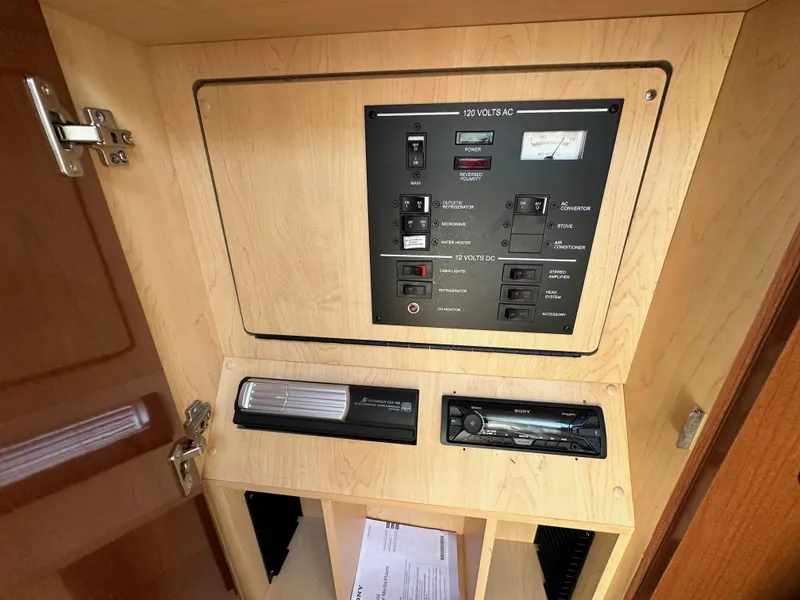 Slide: The Image of Electrical control panel inside 2009 Sea Ray 280 Sundancer boat cabin. - 33