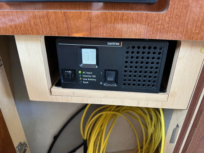 Slide: The Image of Xantrex inverter in 2009 Sea Ray 280 Sundancer, with yellow cables visible below. - 34