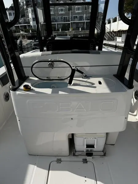 Slide: The Image of 2022 Robalo R272 boat interior with steering wheel and control panel. - 8