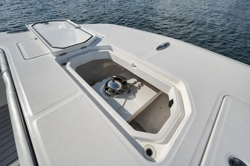 Slide: The Image of Anchor compartment on 2018 Invincible 40 Catamaran, open hatch, ocean background. - 15