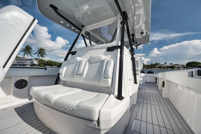 Slide: The Image of Luxurious seating on 2018 Invincible 40 Catamaran, featuring sleek design and ocean backdrop. - 18