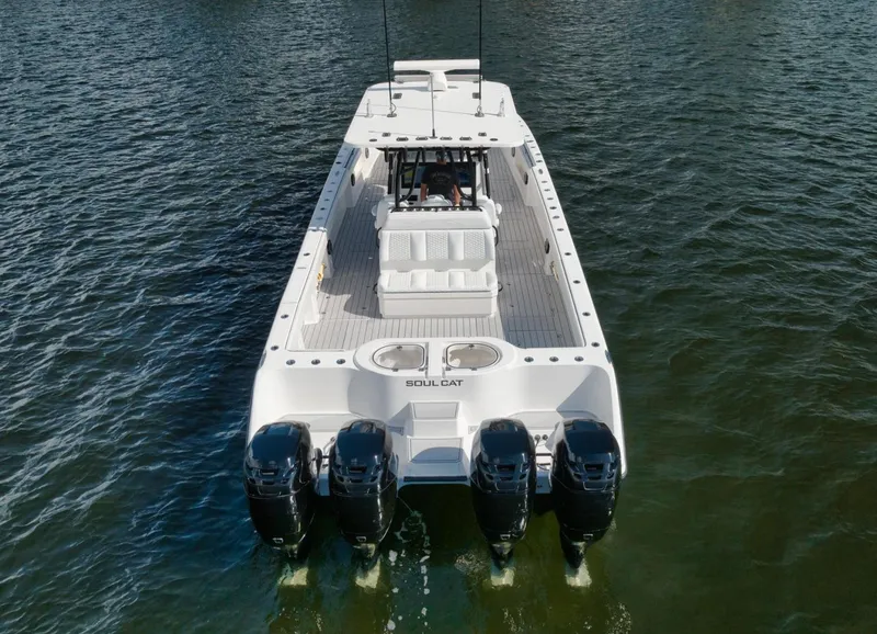 Slide: The Image of 2018 Invincible 40 Catamaran with four engines on water. - 21