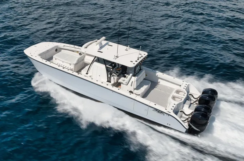 Slide: The Image of 2018 Invincible 40 Catamaran cruising on open water, showcasing powerful engines. - 24