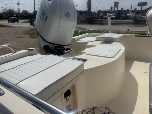 Slide: The Image of 2004 Key West 196 Bay Reef boat interior with Suzuki outboard motor. - 10