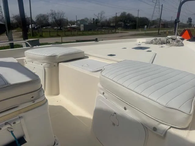 Slide: The Image of 2004 Key West 196 Bay Reef boat interior with white cushioned seating. - 13