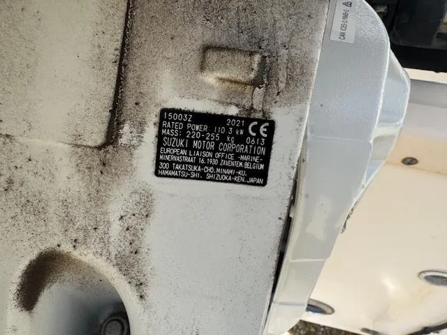 Slide: The Image of Close-up of a Suzuki motor label on a 2004 Key West 196 Bay Reef boat. - 14