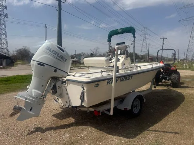 Slide: The Image of 2004 Key West 196 Bay Reef boat with Suzuki outboard motor on trailer. - 4