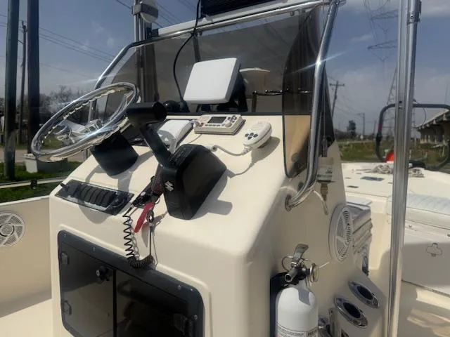Slide: The Image of 2004 Key West 196 Bay Reef boat console with steering wheel and navigation equipment. - 8