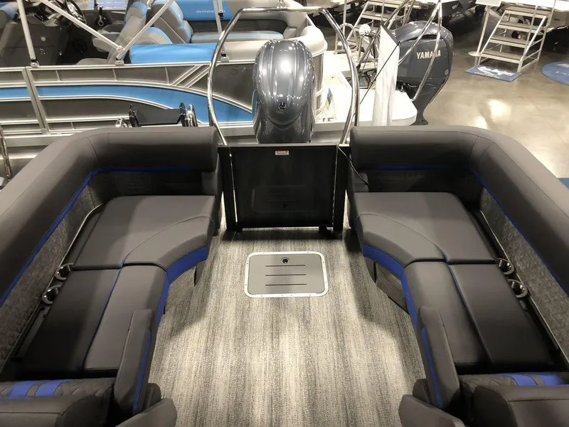 Slide: The Image of 2025 Bennington M Quad Bench 24 MFB pontoon boat interior with plush seating. - 11