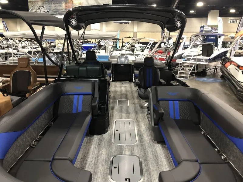 Slide: The Image of 2025 Bennington M Quad Bench 24 MFB pontoon boat interior with luxurious seating and modern design. - 3