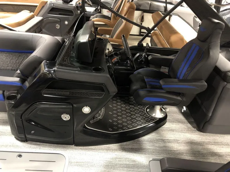 Slide: The Image of Bennington M Quad Bench 24 MFB 2025 boat interior with modern helm and seating. - 7