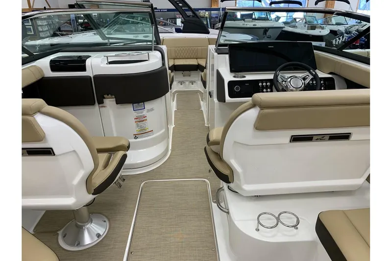 Slide: The Image of Interior view of 2020 Sea Ray 280 SLX boat with beige seating and modern dashboard. - 12
