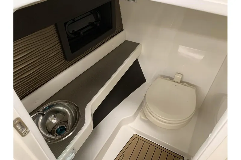 Slide: The Image of 2020 Sea Ray 280 SLX boat interior with sink and toilet. - 16