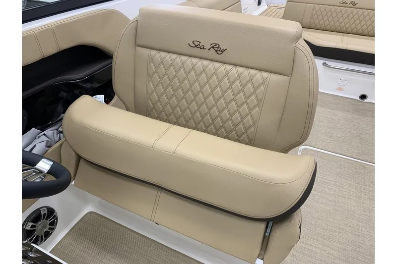 Slide: The Image of 2020 Sea Ray 280 SLX boat interior with beige leather seating and diamond stitching. - 17