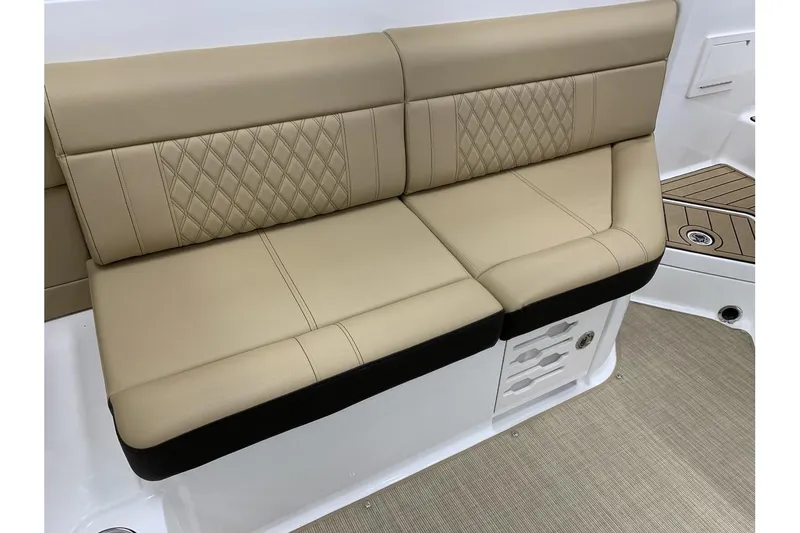 Slide: The Image of 2020 Sea Ray 280 SLX boat interior with beige leather seating and diamond stitching. - 21