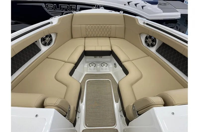 Slide: The Image of 2020 Sea Ray 280 SLX boat interior with beige seating and modern design. - 22
