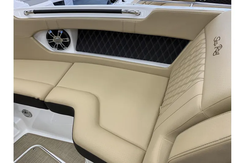 Slide: The Image of 2020 Sea Ray 280 SLX boat interior with beige leather seating and speaker. - 23