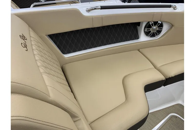 Slide: The Image of 2020 Sea Ray 280 SLX interior with beige leather seating and speaker detail. - 24