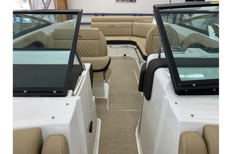 Slide: The Image of 2020 Sea Ray 280 SLX boat interior with beige seating and glass windshields. - 25