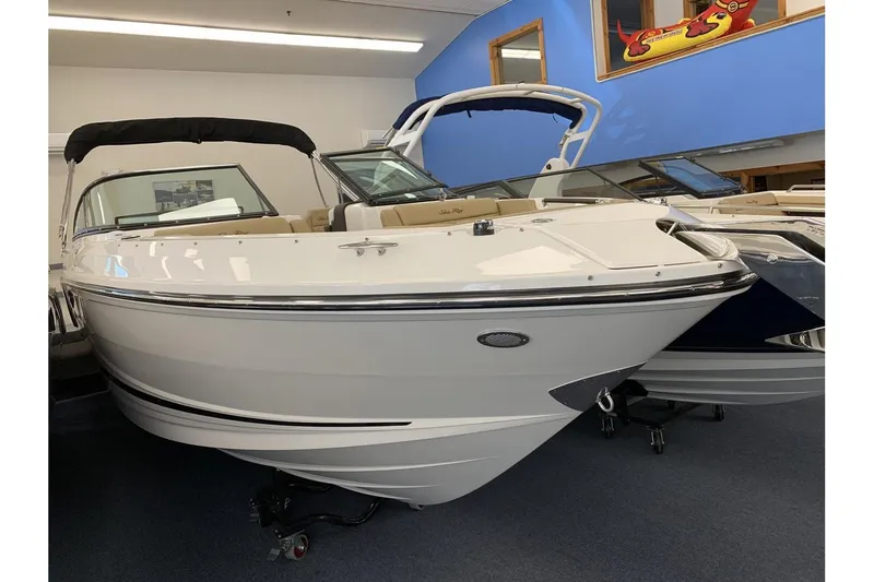 Slide: The Image of 2020 Sea Ray 280 SLX boat displayed indoors, featuring sleek white design. - 3